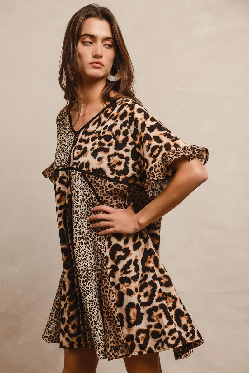 Leopard Print Mix and Match Mini Dress-Leopard Print Mix & Match Mini Dress, featuring a mix of leopard prints in rich, earthy tones. Designed with a V-neckline, flutter sleeves, and an empire waist.-Reef Love Boho-Chic Boutique