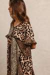 Leopard Print Mix and Match Mini Dress-Leopard Print Mix & Match Mini Dress, featuring a mix of leopard prints in rich, earthy tones. Designed with a V-neckline, flutter sleeves, and an empire waist.-Reef Love Boho-Chic Boutique
