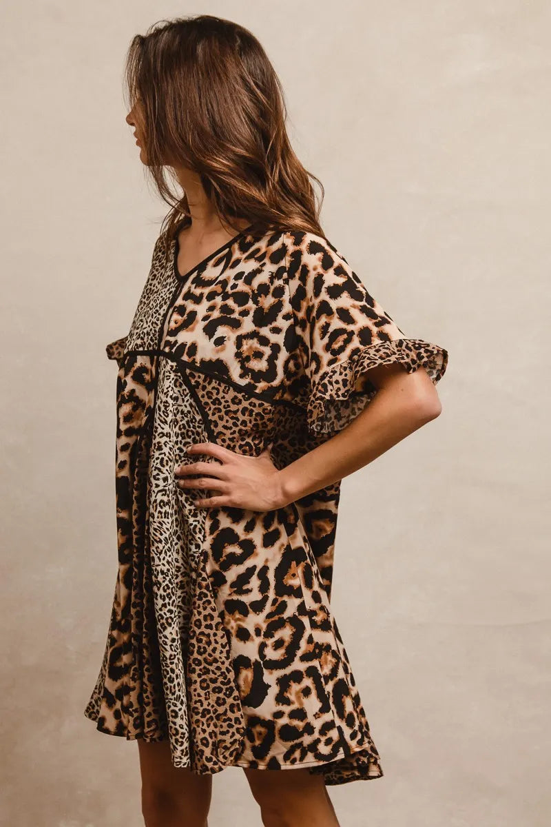 Leopard Print Mix and Match Mini Dress-Leopard Print Mix & Match Mini Dress, featuring a mix of leopard prints in rich, earthy tones. Designed with a V-neckline, flutter sleeves, and an empire waist.-Reef Love Boho-Chic Boutique