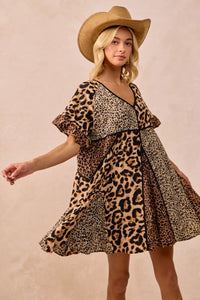 Leopard Print Mix and Match Mini Dress-Leopard Print Mix & Match Mini Dress, featuring a mix of leopard prints in rich, earthy tones. Designed with a V-neckline, flutter sleeves, and an empire waist.-Reef Love Boho-Chic Boutique
