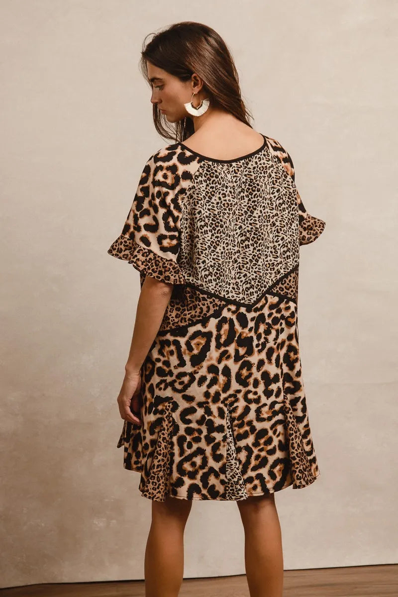 Leopard Print Mix and Match Mini Dress-Leopard Print Mix & Match Mini Dress, featuring a mix of leopard prints in rich, earthy tones. Designed with a V-neckline, flutter sleeves, and an empire waist.-Reef Love Boho-Chic Boutique