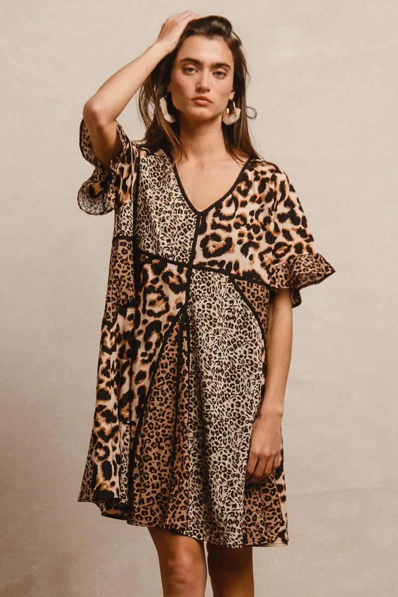 Leopard Print Mix and Match Mini Dress-Leopard Print Mix & Match Mini Dress, featuring a mix of leopard prints in rich, earthy tones. Designed with a V-neckline, flutter sleeves, and an empire waist.-Reef Love Boho-Chic Boutique