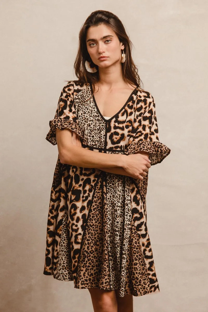 Leopard Print Mix and Match Mini Dress-Leopard Print Mix & Match Mini Dress, featuring a mix of leopard prints in rich, earthy tones. Designed with a V-neckline, flutter sleeves, and an empire waist.-Reef Love Boho-Chic Boutique