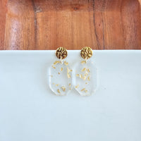 Shop Lexi Earrings - Gold Foil-Clear acrylic statement earrings with gold foil specks and hypoallergenic gold-plated posts. Lightweight glam perfect for day-to-night, minimalist, or elegant looks.-available at Reef Love online boho-chic boutique
