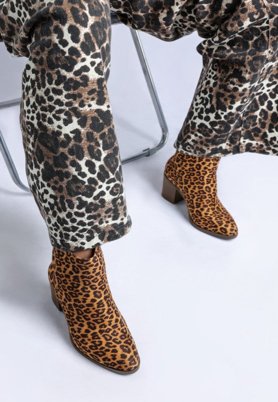 Lunara Leopard Print Block Heel Boots-Lunara leopard print block heel boots by London Rag. Chic microfiber ankle boots with 3" stacked heel, almond toe & cushioned insoles. Bold statement style.