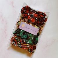 Merry Plaid Scrunchies, Pack of 4-Brighten up your holiday wardrobe with the Merry Plaid Scrunchies, Featuring four different colors and patterns. Perfect for a festive gift or stocking stuffer.