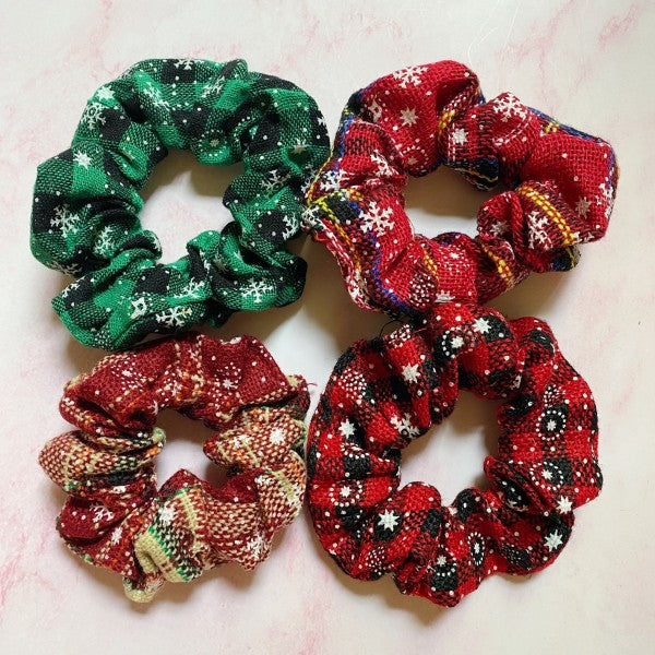 Merry Plaid Scrunchies, Pack of 4-Brighten up your holiday wardrobe with the Merry Plaid Scrunchies, Featuring four different colors and patterns. Perfect for a festive gift or stocking stuffer.