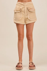 Shop Mineral Washed Terry High Rise Cargo Shorts-High rise cargo shorts with utility pockets in mineral-washed beige. Soft cotton blend, relaxed fit—perfect for casual summer looks and everyday comfort.-available at Reef Love online boho-chic boutique