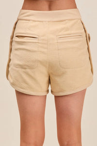 Shop Mineral Washed Terry High Rise Cargo Shorts-High rise cargo shorts with utility pockets in mineral-washed beige. Soft cotton blend, relaxed fit—perfect for casual summer looks and everyday comfort.-available at Reef Love online boho-chic boutique