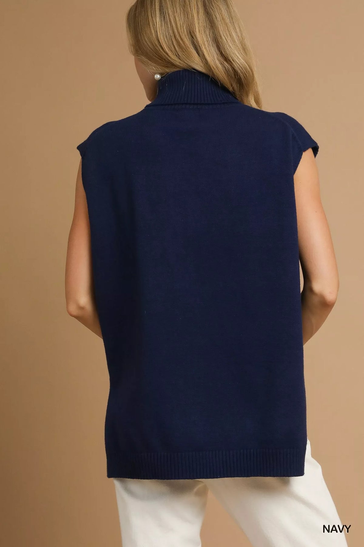 Navy High-Low Turtleneck Sleeveless Sweater-The Navy Blue High-Low Turtleneck Sleeveless Sweater is a stylish and versatile piece. The turtleneck adds a sophisticated touch to the sleeveless design. 