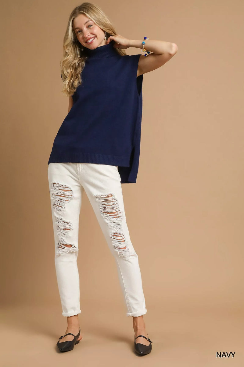 Navy High-Low Turtleneck Sleeveless Sweater-The Navy Blue High-Low Turtleneck Sleeveless Sweater is a stylish and versatile piece. The turtleneck adds a sophisticated touch to the sleeveless design. 