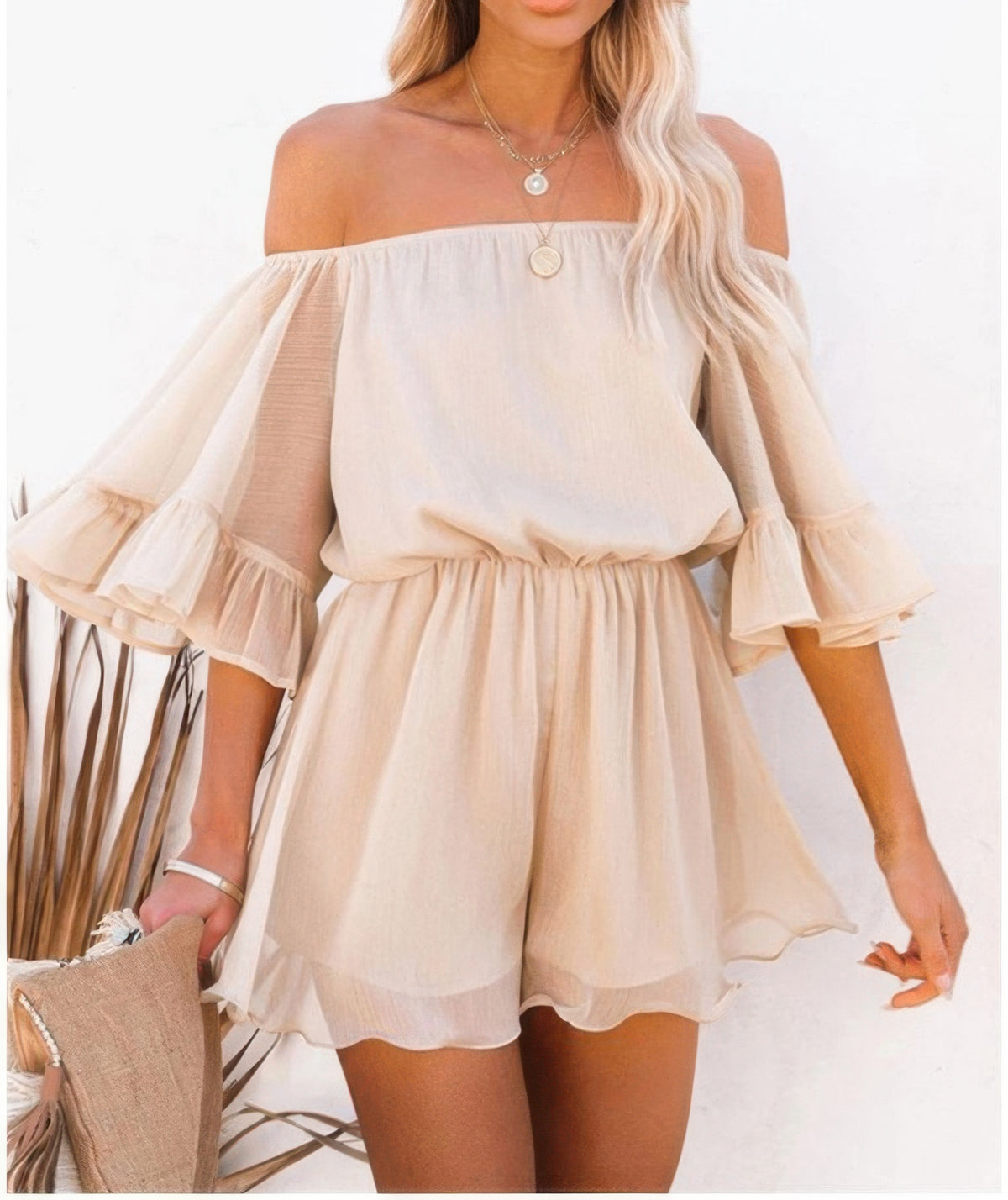 Off Shoulder Flounce Bell Sleeve Romper brings a touch of boho chic to your warm-weather wardrobe.