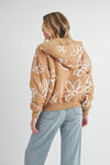 Shop Oita Floral Zip Front Hoodie-Cozy meets cool in the Oita Floral Zip-Up Hoodie - sherpa-lined warmth, bold floral print, and a bomber fit make this your new cold-weather go-to.-available at Reef Love online boho-chic boutique