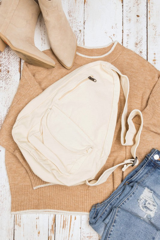 Oversized Canvas Sling Backpack-Oversized canvas sling backpack with adjustable strap and zip pockets. Lightweight, casual, and perfect for everyday or carrying travel essentials.-Reef Love