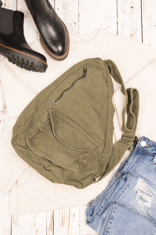 Oversized Canvas Sling Backpack-Oversized canvas sling backpack with adjustable strap and zip pockets. Lightweight, casual, and perfect for everyday or carrying travel essentials.-Reef Love