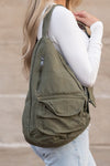 Oversized Canvas Sling Backpack-Oversized canvas sling backpack with adjustable strap and zip pockets. Lightweight, casual, and perfect for everyday or carrying travel essentials.-Reef Love