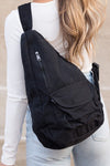 Oversized Canvas Sling Backpack-Oversized canvas sling backpack with adjustable strap and zip pockets. Lightweight, casual, and perfect for everyday or carrying travel essentials.-Reef Love