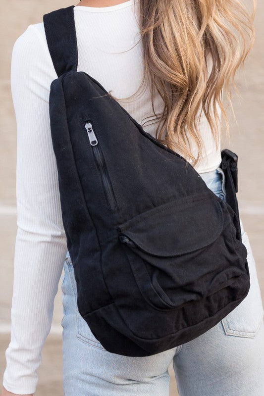 Oversized Canvas Sling Backpack-Oversized canvas sling backpack with adjustable strap and zip pockets. Lightweight, casual, and perfect for everyday or carrying travel essentials.-Reef Love