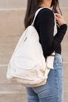 Oversized Canvas Sling Backpack-Oversized canvas sling backpack with adjustable strap and zip pockets. Lightweight, casual, and perfect for everyday or carrying travel essentials.-Reef Love
