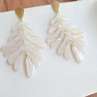 Shop Palm Earrings - Seashell Cream-Seashell cream palm leaf earrings with gold accents. Lightweight, tropical-inspired statement style—perfect for vacations, summer events, or everyday chic.-available at Reef Love online boho-chic boutique