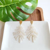 Shop Palm Earrings - Seashell Cream-Seashell cream palm leaf earrings with gold accents. Lightweight, tropical-inspired statement style—perfect for vacations, summer events, or everyday chic.-available at Reef Love online boho-chic boutique