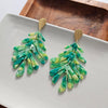 Shop Palm Leaf Earrings - Green-Green palm leaf statement earrings with gold accents. Lightweight, tropical, and bold—perfect for vacations, events, or adding resort style to everyday looks.-available at Reef Love online boho-chic boutique