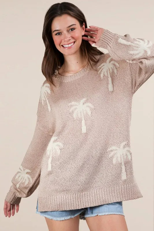 Women's beige color palm tree graphic oversized knit sweater is a cozy and stylish sweater. The oversized fit adds a relaxed and comfortable vibe to the sweater - sold by Reef Love