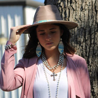 Shop Pastel Navajo Leather Oval Earrings with Turquoise Accent-Western-inspired Handmade pastel Navajo leather earrings with turquoise bead accent. Lightweight, hypoallergenic, and boho-chic—each pair is one of a kind.-available at Reef Love online boho-chic boutique