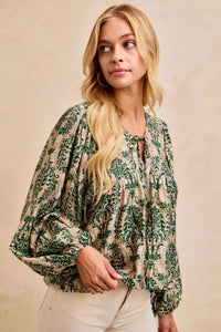 Printed Balloon Sleeve Front Tied Blouse-The printed woven front tied blouse with balloon sleeves is a stylish and feminine choice for adding a touch of flair to your outfit creating a flattering silhouette.