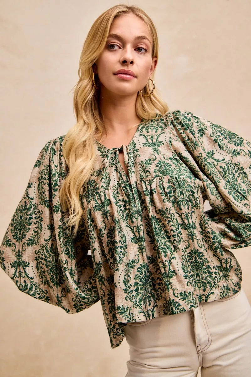 Printed Balloon Sleeve Front Tied Blouse-The printed woven front tied blouse with balloon sleeves is a stylish and feminine choice for adding a touch of flair to your outfit creating a flattering silhouette.