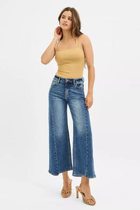 RISEN High Rise Crop Wide Leg Jeans with Step Hem-Elevate your denim game with these High Rise Crop Wide Leg Jeans featuring a trendy step hem detail. The high-rise silhouette offers a flattering fit.