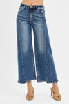 RISEN High Rise Crop Wide Leg Jeans with Step Hem-Elevate your denim game with these High Rise Crop Wide Leg Jeans featuring a trendy step hem detail. The high-rise silhouette offers a flattering fit.