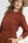 Rust Drawstring Cable Knit Mini Dress-Rust Drawstring Cable Knit Mini Dress. This cable knit mini dress features a drawstring waist and convenient pockets for a cozy and practical look. 