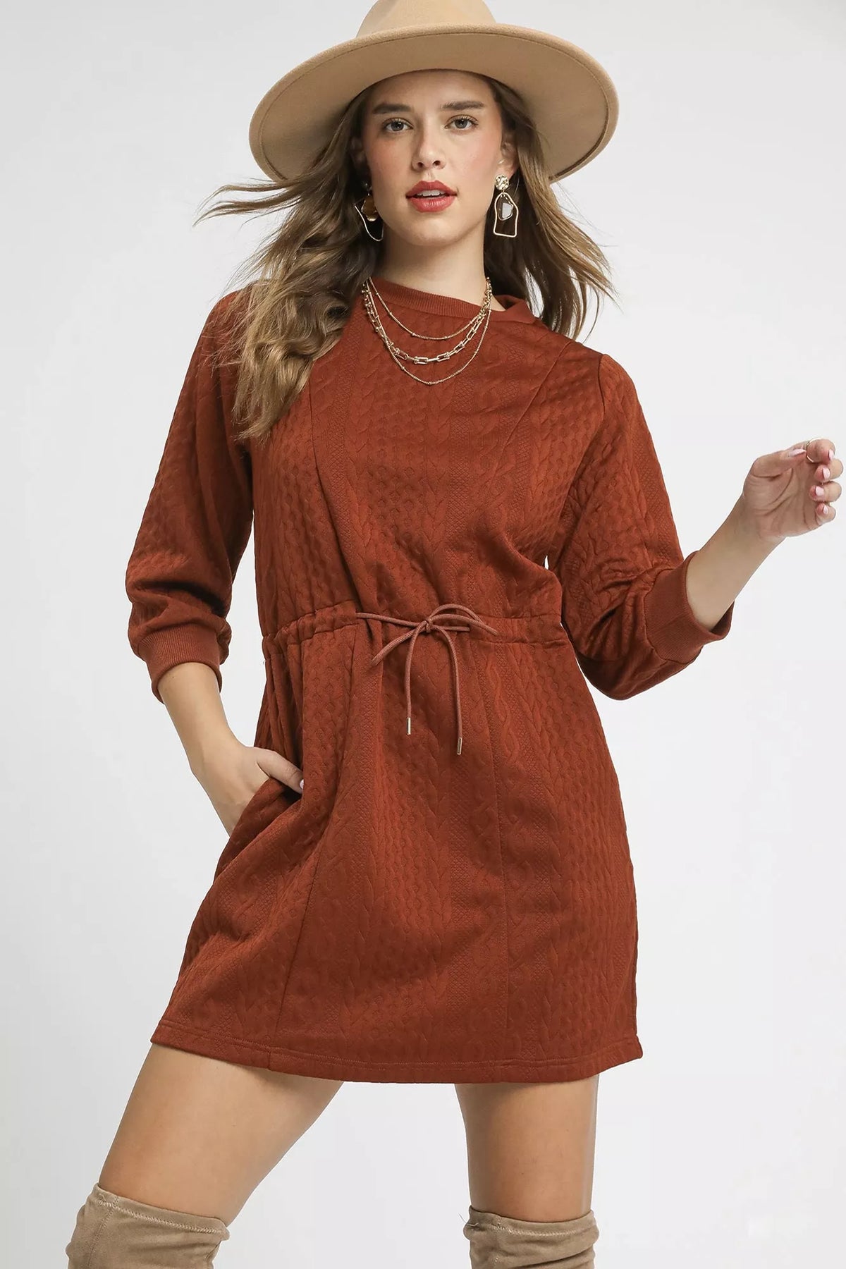 Rust Drawstring Cable Knit Mini Dress-Rust Drawstring Cable Knit Mini Dress. This cable knit mini dress features a drawstring waist and convenient pockets for a cozy and practical look. 