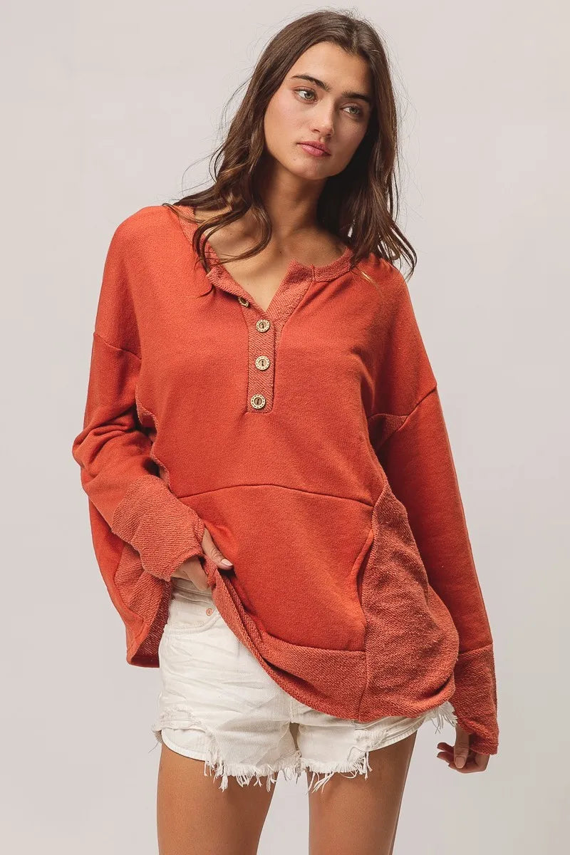 Rust French Terry Knit Side Block Buttoned Henley Top-Rust French terry Henley top with side block detail and button accents. Oversized, cozy knit with pockets—perfect for casual fall outfits or lounging.-Reef Love