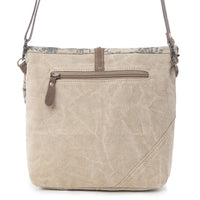 Beige crossbody bag with brown accents on a white background
