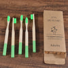 Woman wearing 5 Pack Adult Bamboo Toothbrush Medium Bristles Eco Friendly-5-pack bamboo toothbrush set with biodegradable handles & medium BPA-free bristles. Eco-friendly, vegan, plastic-free & individually packaged.