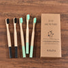 Woman wearing 5 Pack Adult Bamboo Toothbrush Medium Bristles Eco Friendly-5-pack bamboo toothbrush set with biodegradable handles & medium BPA-free bristles. Eco-friendly, vegan, plastic-free & individually packaged.