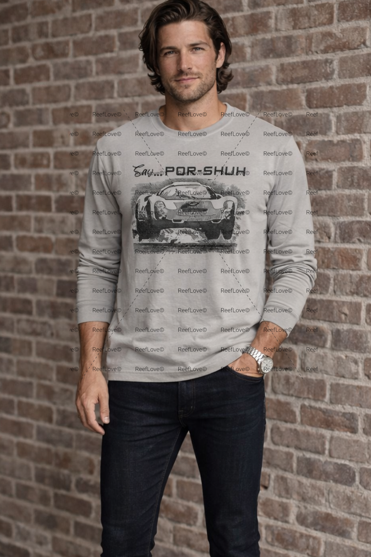 Man wearing a gray sweatshirt with a Porsche logo against a brick wall