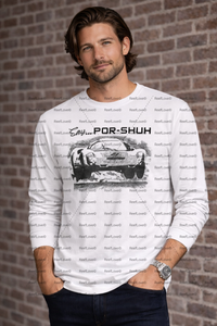 Man wearing a white long-sleeve shirt with a vintage porsche 396 car graphic and text against a brick wall.