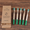 Woman wearing 5 Pack Adult Bamboo Toothbrush Medium Bristles Eco Friendly-5-pack bamboo toothbrush set with biodegradable handles & medium BPA-free bristles. Eco-friendly, vegan, plastic-free & individually packaged.