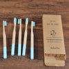 Woman wearing 5 Pack Adult Bamboo Toothbrush Medium Bristles Eco Friendly-5-pack bamboo toothbrush set with biodegradable handles & medium BPA-free bristles. Eco-friendly, vegan, plastic-free & individually packaged.