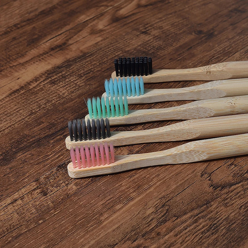Woman wearing 5 Pack Adult Bamboo Toothbrush Medium Bristles Eco Friendly-5-pack bamboo toothbrush set with biodegradable handles & medium BPA-free bristles. Eco-friendly, vegan, plastic-free & individually packaged.