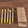 Woman wearing 5 Pack Adult Bamboo Toothbrush Medium Bristles Eco Friendly-5-pack bamboo toothbrush set with biodegradable handles & medium BPA-free bristles. Eco-friendly, vegan, plastic-free & individually packaged.