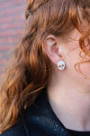 Shop Skull Studs - White Glitter-White glitter skull stud earrings made from lightweight acrylic with hypoallergenic posts. A sparkling, spooky touch for Halloween or fun everyday edgy style.-available at Reef Love online boho-chic boutique