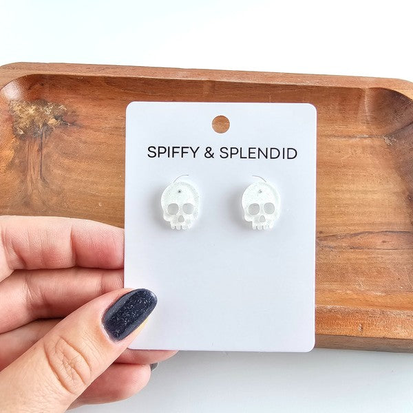 Shop Skull Studs - White Glitter-White glitter skull stud earrings made from lightweight acrylic with hypoallergenic posts. A sparkling, spooky touch for Halloween or fun everyday edgy style.-available at Reef Love online boho-chic boutique