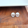Shop Skull Studs - White Glitter-White glitter skull stud earrings made from lightweight acrylic with hypoallergenic posts. A sparkling, spooky touch for Halloween or fun everyday edgy style.-available at Reef Love online boho-chic boutique