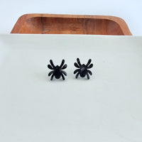 Shop Spider Stud Earrings - Black-Black spider stud earrings made from lightweight acrylic with hypoallergenic posts. A spooky-cute finishing touch for Halloween or everyday eerie style.-available at Reef Love online boho-chic boutique