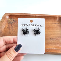 Shop Spider Stud Earrings - Black-Black spider stud earrings made from lightweight acrylic with hypoallergenic posts. A spooky-cute finishing touch for Halloween or everyday eerie style.-available at Reef Love online boho-chic boutique