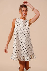 Texture Bow Printed Ruffle Mini Dress-Chic black & white bow print mini dress with a playful ruffle hem. Sleeveless & lightweight for effortless summer style, perfect for day or night outings.-Reef Love Boho-Chic Boutique